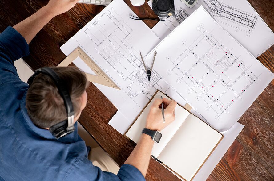 top-view-of-professional-engineer-with-notebook-an-2023-11-27-05-30-28-utc 1